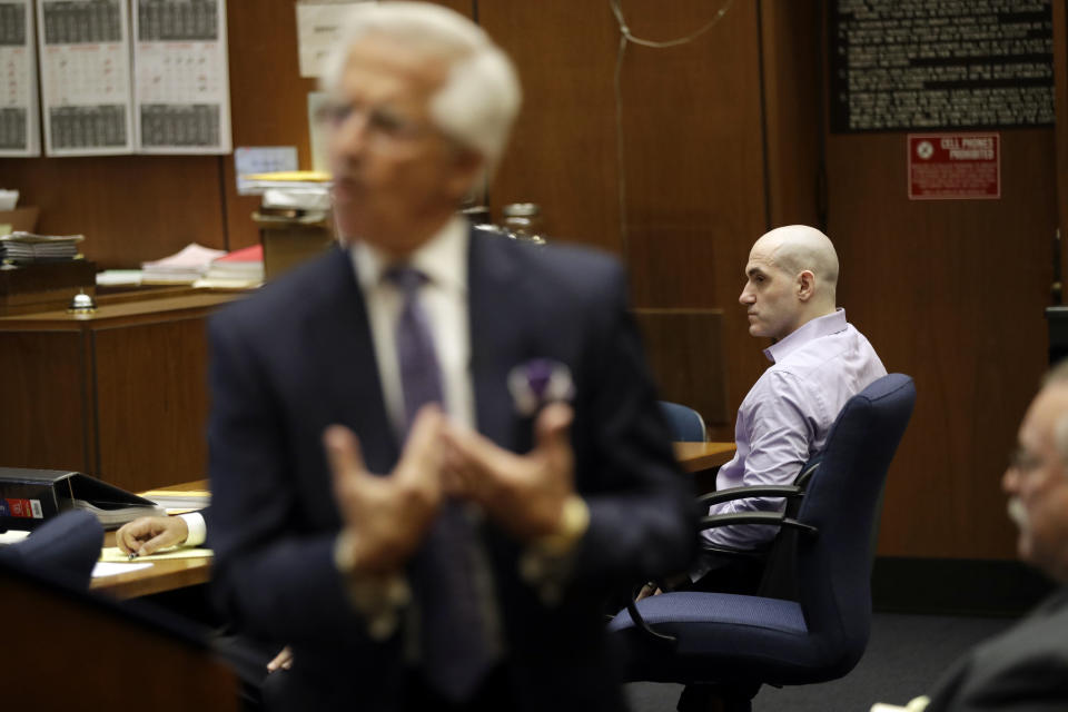 Attorney Daniel Nardoni, left, presents closing arguments for his client Michael Gargiulo, background right, during the trial of People vs. Michael Gargiulo Wednesday, Aug. 7, 2019, in Los Angeles. Closing arguments continued Wednesday in the trial of an air conditioning repairman charged with killing two Southern California women and attempting to kill a third. (AP Photo/Marcio Jose Sanchez, Pool)