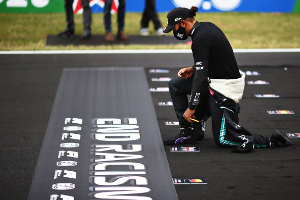 Lewis Hamilton takes a knee on the grid in support of ending racism during the F1 Grand Prix of Portugal