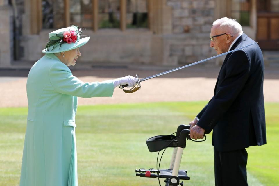 Captain Sir Thomas Moore receiving his knighthood from the Queen during a ceremony at Windsor Castle (PA Archive)