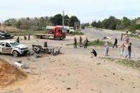 General view of damage at the scene of an explosion at the Mislattah checkpoint near Khoms, on the coast road between Tripoli and Misrata, Libya November 24, 2015. REUTERS/Stringer