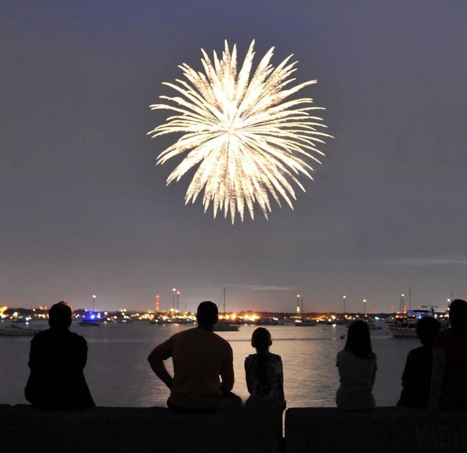 A family watches fireworks in Hingham during a July 4 celebration.