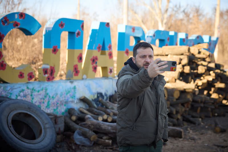 Ukraine’s President Zelenskiy captures a video to congratulate the Ukrainian Armed Forces amid Russia’s attack on Ukraine, near the town of Sloviansk