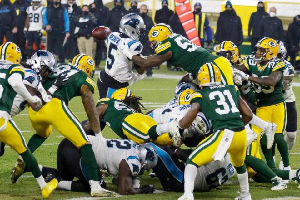 Green Bay’s Krys Barnes knocks the ball away from Carolina Panthers quarterback Teddy Bridgewater on Dec. 19th. Panthers head coach Matt Rhule said later that the coaching staff had taught the players not to stick the ball out at the goal line.