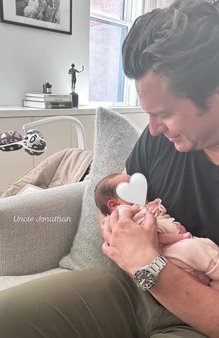 <p>Lea Michele/Instagram</p> Jonathan Groff holding Lea Michele's newborn daughter.