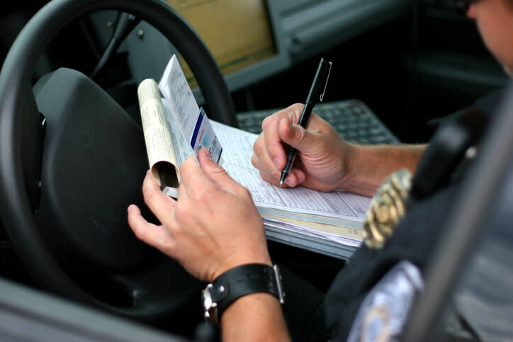 Police officer writing ticket. Source: Getty