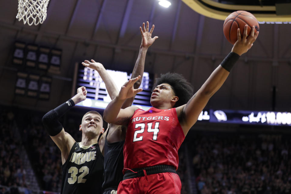 Rutgers guard Ron Harper Jr. (24) shoots over Purdue center Matt Haarms (32) during the first half of an NCAA college basketball game in West Lafayette, Ind., Saturday, March 7, 2020. (AP Photo/Michael Conroy)