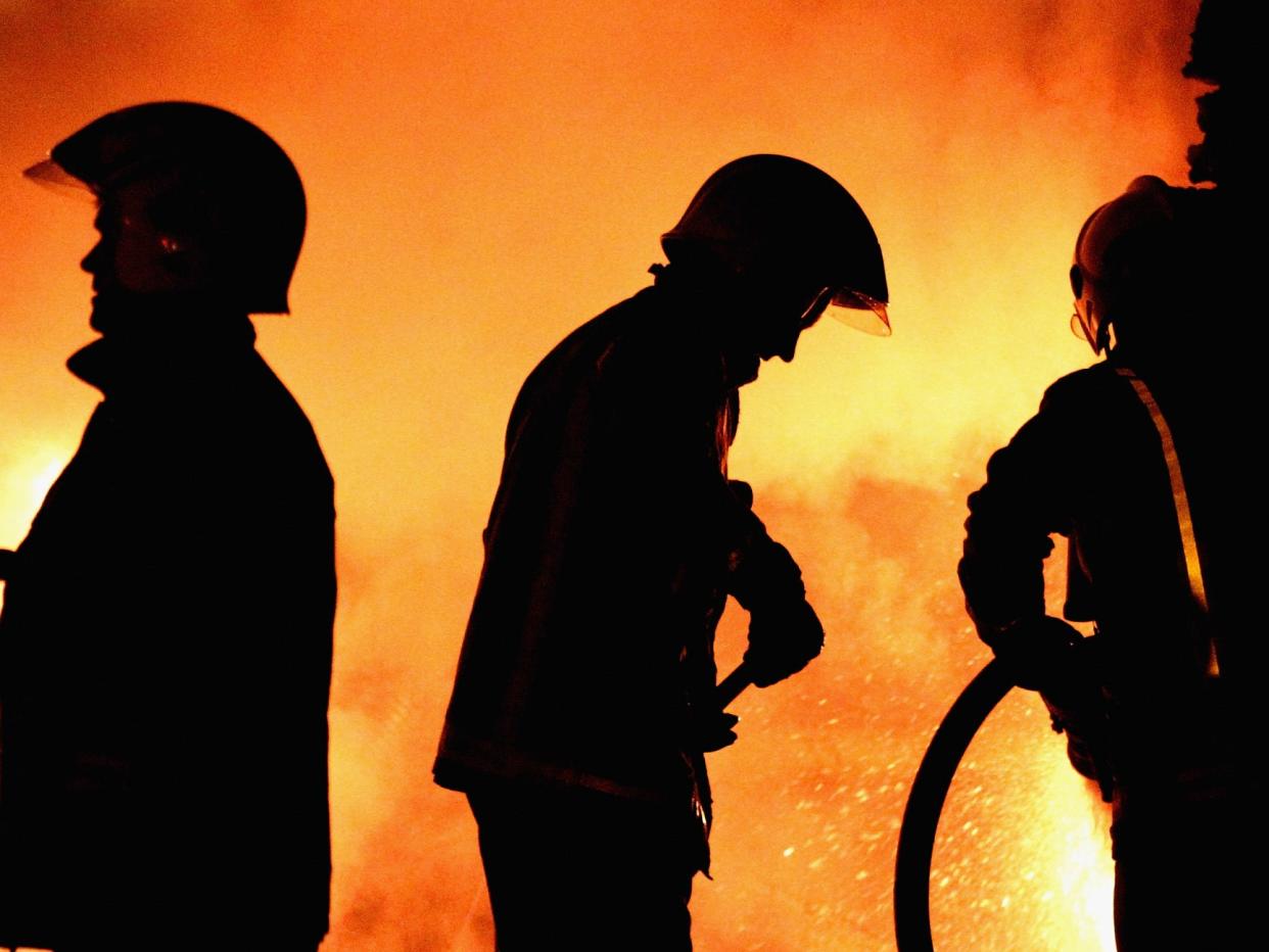 <p>Firefighters attend a fire in Glasgow</p> (Jeff J Mitchell/Getty Images)