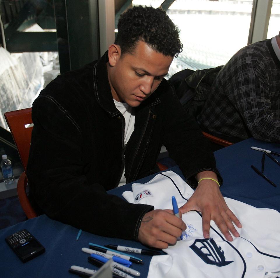Miguel Cabrera signs an autograph on a jersey for a fan as the Detroit Tigers held Tiger Fest at Comerica Park, Jan. 12, 2008.