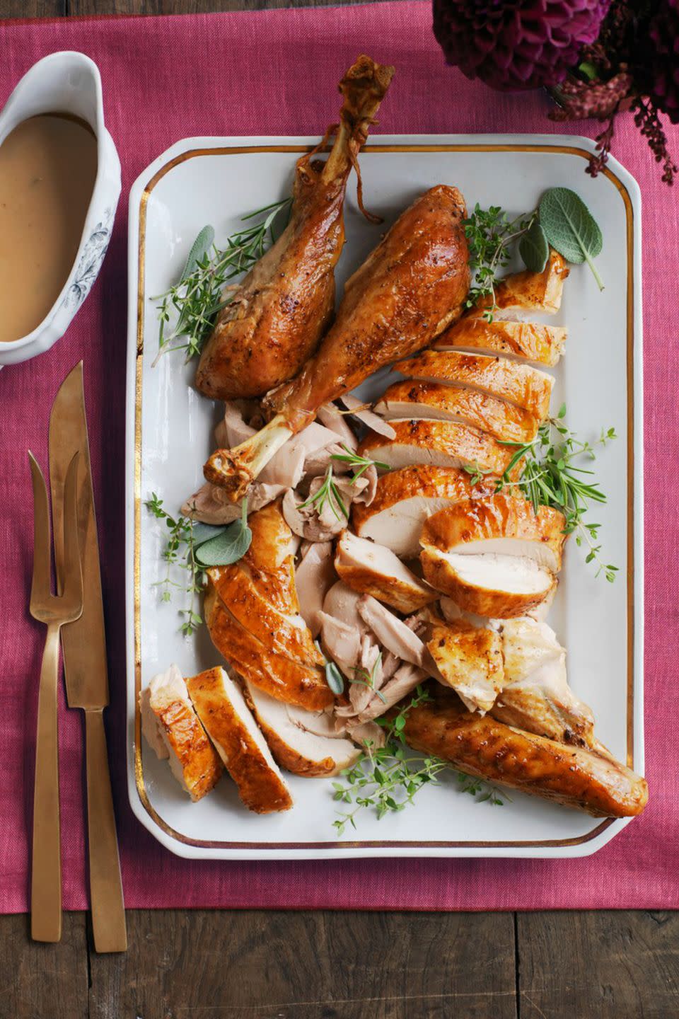 <p>Who says you can only have turkey at Thanksgiving? Wow your guests with this exquisite turkey recipe with garlic, olive oil, and fresh thyme.</p><p><a href="https://www.womansday.com/food-recipes/food-drinks/recipes/a52084/garlic-and-herb-roasted-turkey/" rel="nofollow noopener" target="_blank" data-ylk="slk:Get the Garlic and Herb Roasted Turkey recipe.;elm:context_link;itc:0;sec:content-canvas" class="link "><em><strong>Get the Garlic and Herb Roasted Turkey recipe.</strong></em></a> </p>