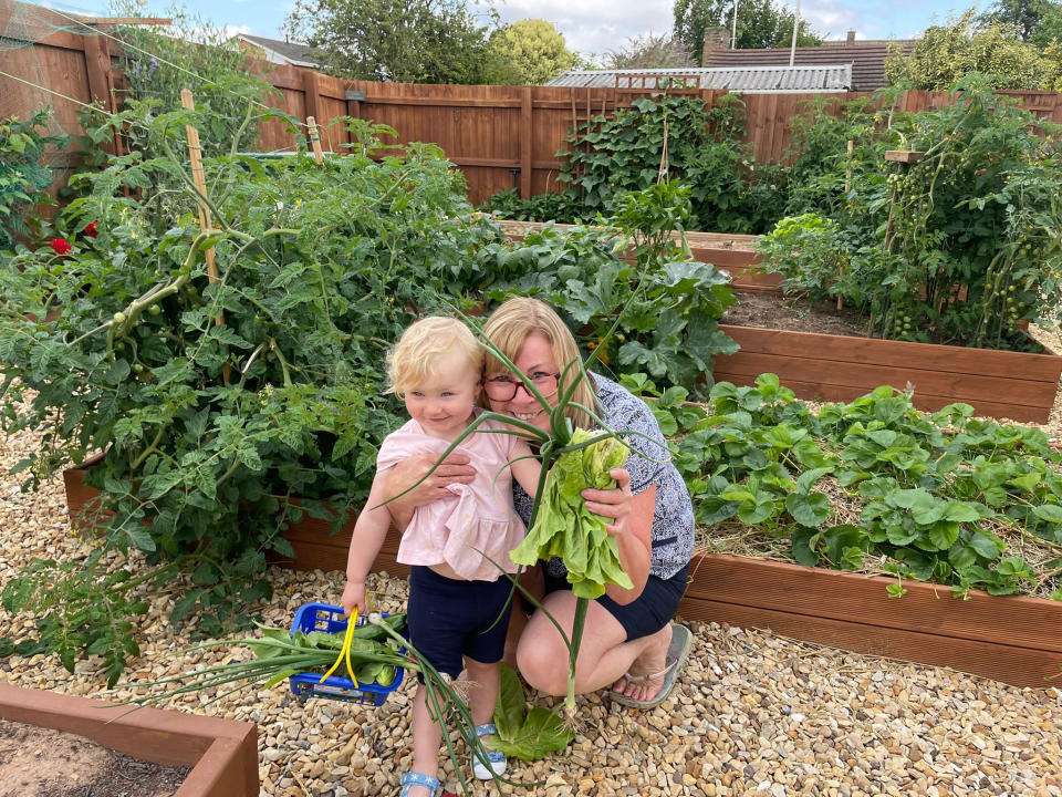 Kirstie Lawes with granddaughter Ella in the vegetable garden. (SWNS)