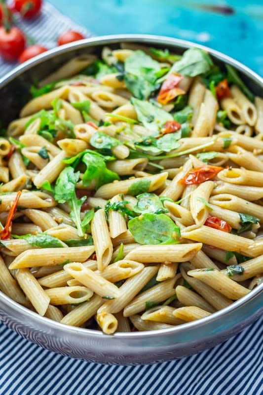<p>The Cook Report</p><p>This recipe is so simple, it takes just 6 ingredients but is bursting with flavor from roasted tomatoes, balsamic and rocket. It is the epitome of a delicious lunch!</p><p><strong>Get the recipe: <a href="https://thecookreport.co.uk/balsamic-pasta-salad/" rel="nofollow noopener" target="_blank" data-ylk="slk:Balsamic Pasta Salad;elm:context_link;itc:0;sec:content-canvas" class="link rapid-noclick-resp"><em>Balsamic Pasta Salad</em></a></strong></p><p><strong>Related: <a href="https://parade.com/1371140/felicialim/salad-dressing-recipes/" rel="nofollow noopener" target="_blank" data-ylk="slk:38 Salad Dressing Recipes To Elevate Your Salads;elm:context_link;itc:0;sec:content-canvas" class="link rapid-noclick-resp">38 Salad Dressing Recipes To Elevate Your Salads</a></strong></p>