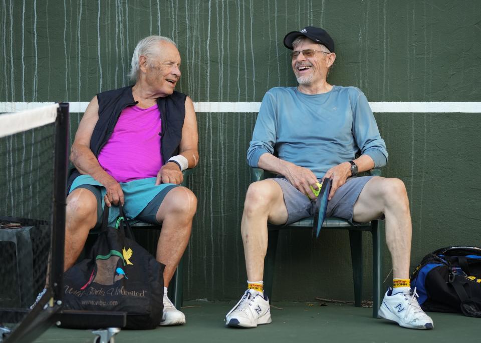 Jimmy Treybig, left, chats with Eric Upton during a break in a pickleball game in Rollingwood last month. Relationships and community are keys to the appeal of the fast-growing sport.
