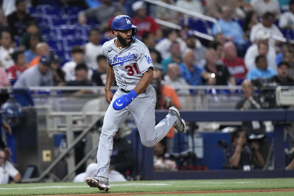Los Angeles Dodgers' Amed Rosario heads home to score on a single by Chris Taylor during the fifth inning of a baseball game against the Miami Marlins, Thursday, Sept. 7, 2023, in Miami. (AP Photo/Wilfredo Lee)