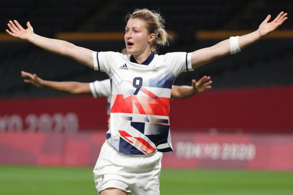 Ellen White celebrates after scoring.