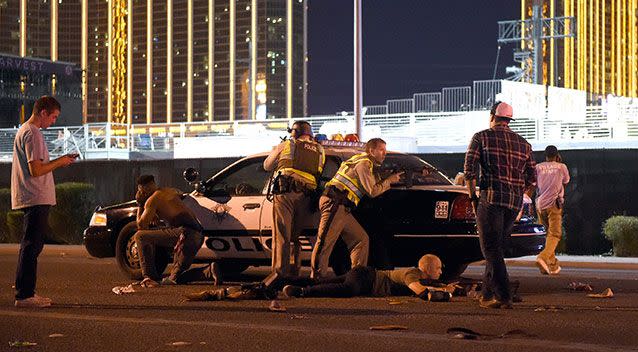 Las Vegas police stand guard along the streets outside the Route 91 Harvest country music festival grounds. Source: Getty Images