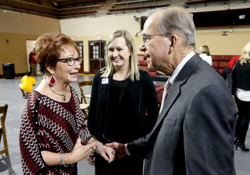 The United Way of West Alabama revealed the annual fund raising goal had been exceeded during an event Dec. 15, 2016 in Foster  Auditorium. Former Alabama gymnastics coach Sarah Patterson greets campaign chairman Robert Witt. In the middle is Laura Green. Patterson and her husband David have been selected as the Alexis de Tocqueville Family of the Year by the United Way.