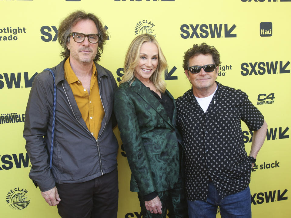 Director Davis Guggenheim, Tracy Pollan and Michael J. Fox, from left, arrive for the world premiere of 