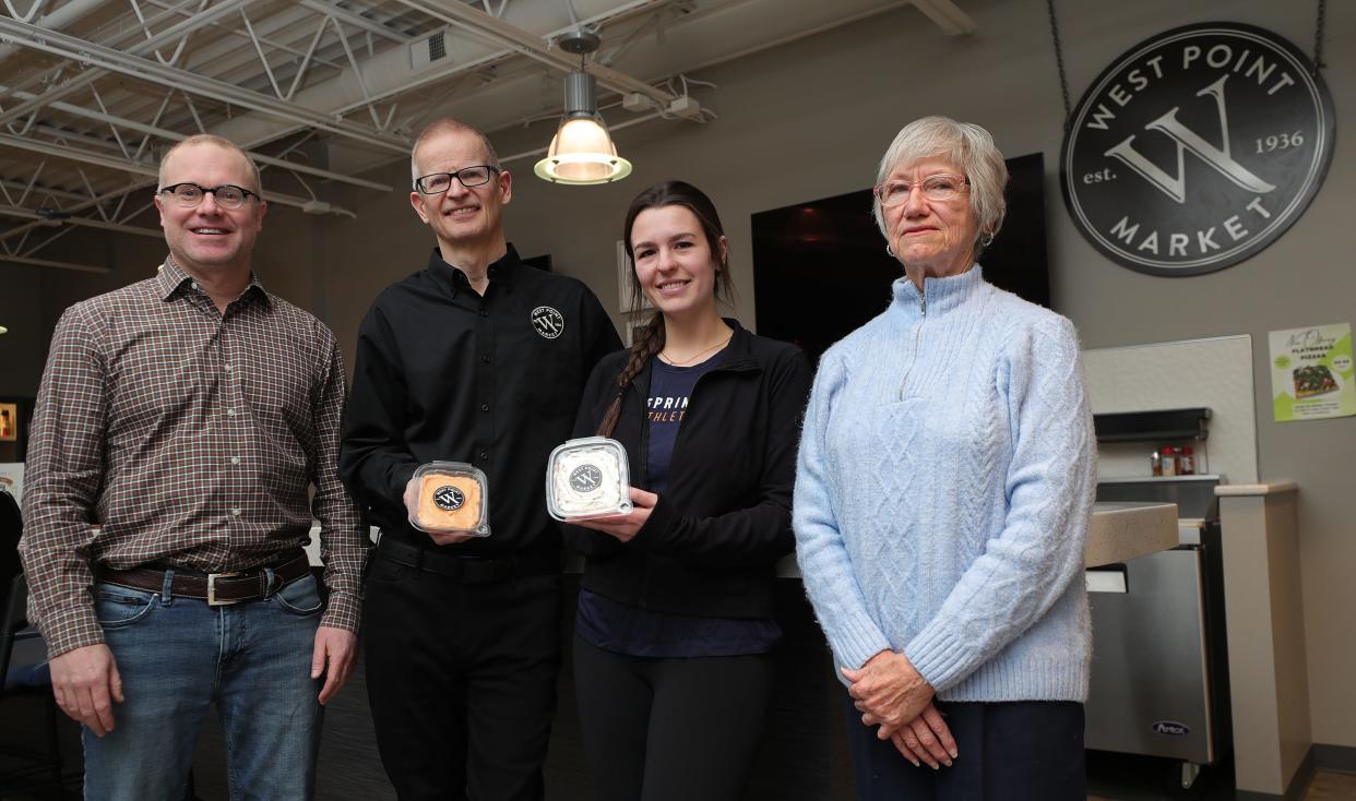 Springside Athletic Club owner Brian Steere, left, Rick Vernon of West Point Market, Demi Boyazis and Diana Bole, former West Point Market cheese shop manager, worked together to re-create the West Point Market cheese spreads sold at the club's cafe.A new business, named Crafty Steere, will soon sell West Point Market's cheese spreads, brownies, cookies and salads under one roof.