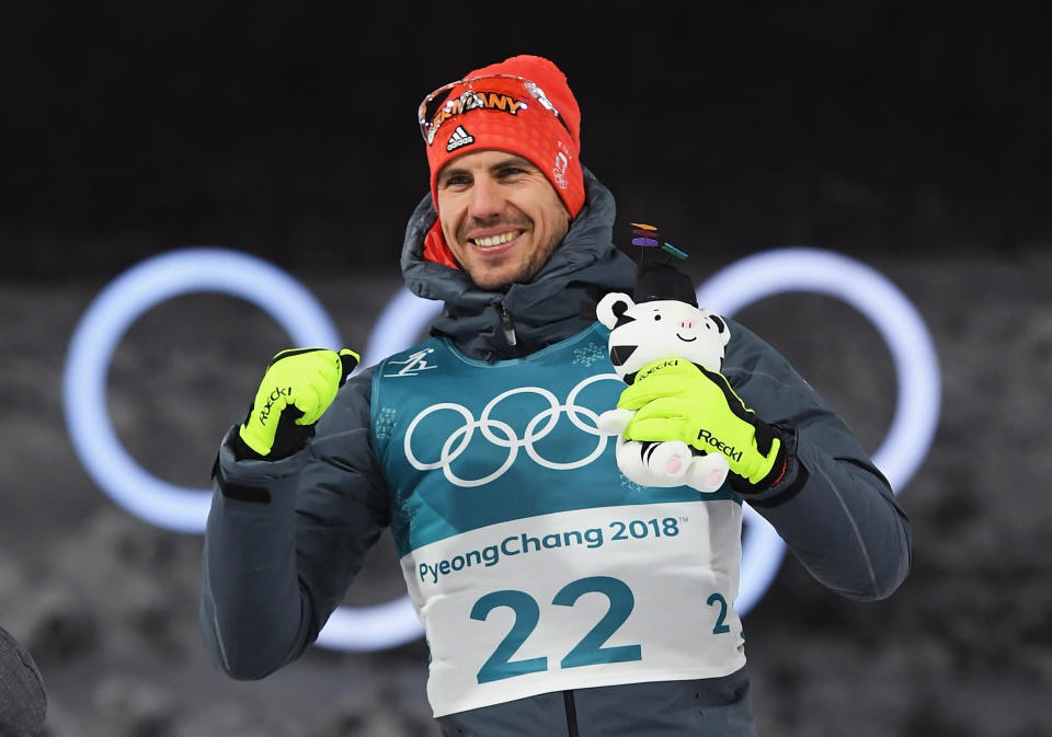 <p>Arnd Peiffer of Germany celebrates winning the gold medal during the victory ceremony after the Men’s 10km Sprint Biathlon. </p>