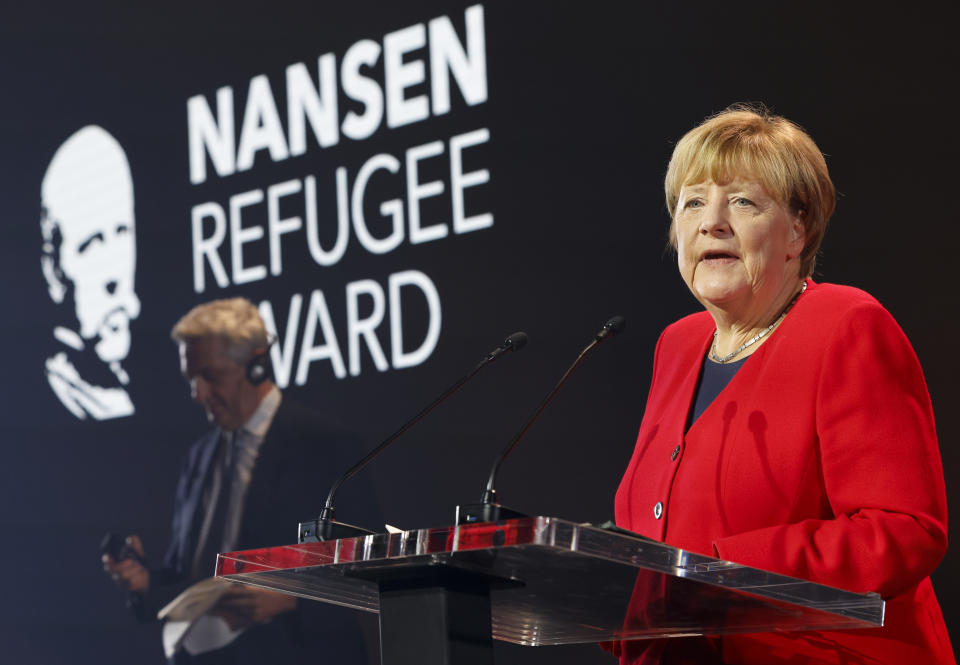Angela Merkel speaks as she receives the UNHCR Nansen Refugee Award for protecting refugees at the height of the Syria crisis, during a ceremony in Geneva, Switzerland, Monday Oct. 10, 2022. (Stefan Wermuth/Pool via AP)