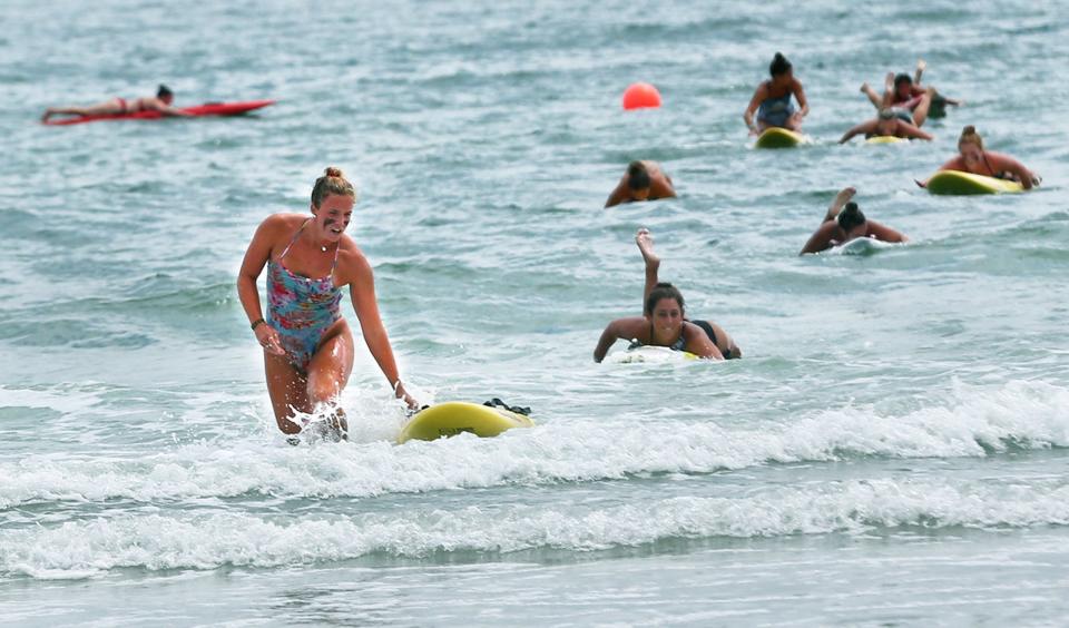 A Hampton lifeguard is first to finish the 500 board contest in Ogunquit during the lifeguard competition Aug. 10, 2022.