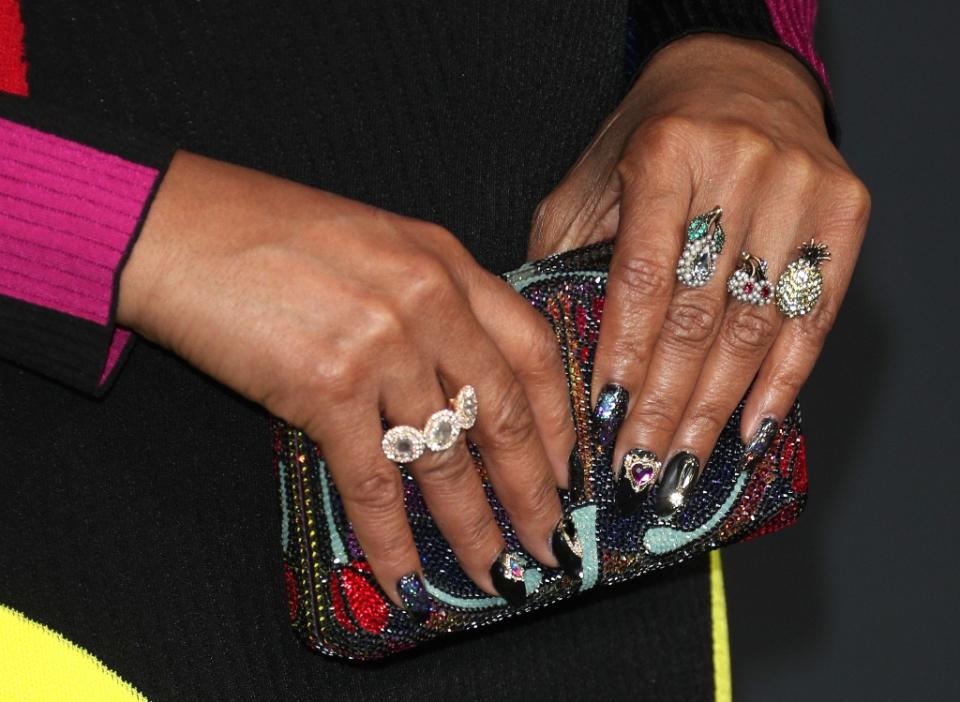 Taraji P. Henson shows off some fun nails and bling on her fingers, including three fruit-inspired rings. - Credit: MEGA