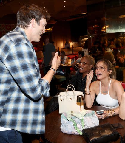 <p>Kevin Mazur/Getty</p> Ashton Kutcher and Jennifer Lopez