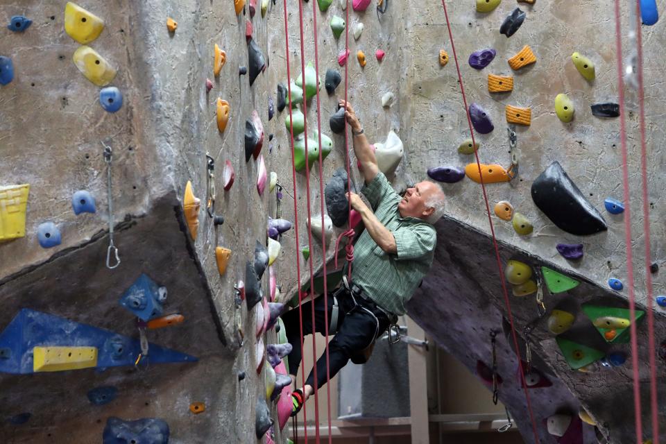 Ken Zadeck, 67, of Chappaqua climbs a wall at The Cliffs Climbing & Fitness, an indoor rock climbing facility in Valhalla Oct. 26, 2023.