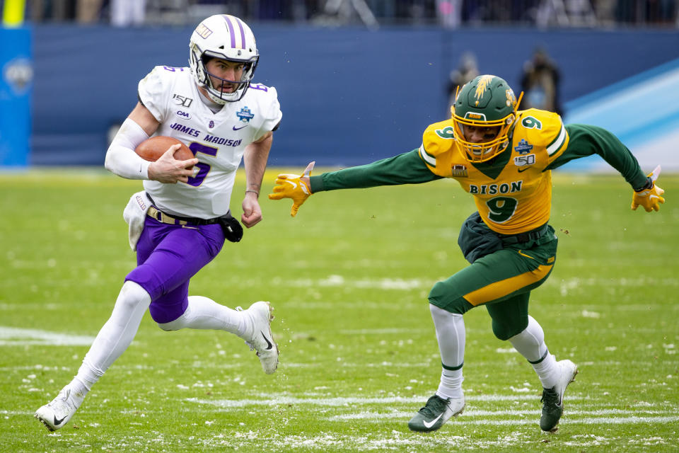 James Madison quarterback Ben DiNucci (6) runs with the ball as North Dakota State cornerback Marquise Bridges (9) pursues during the first half of the FCS championship NCAA college football game, Saturday, Jan. 11, 2020, in Frisco, Texas. (AP Photo/Sam Hodde)
