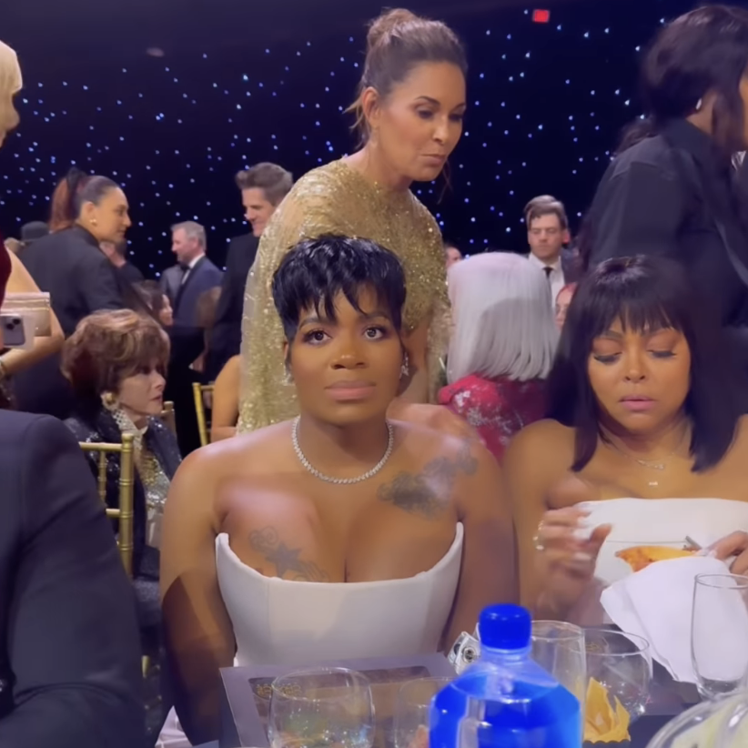 Fantasia Barrino at a table with text 