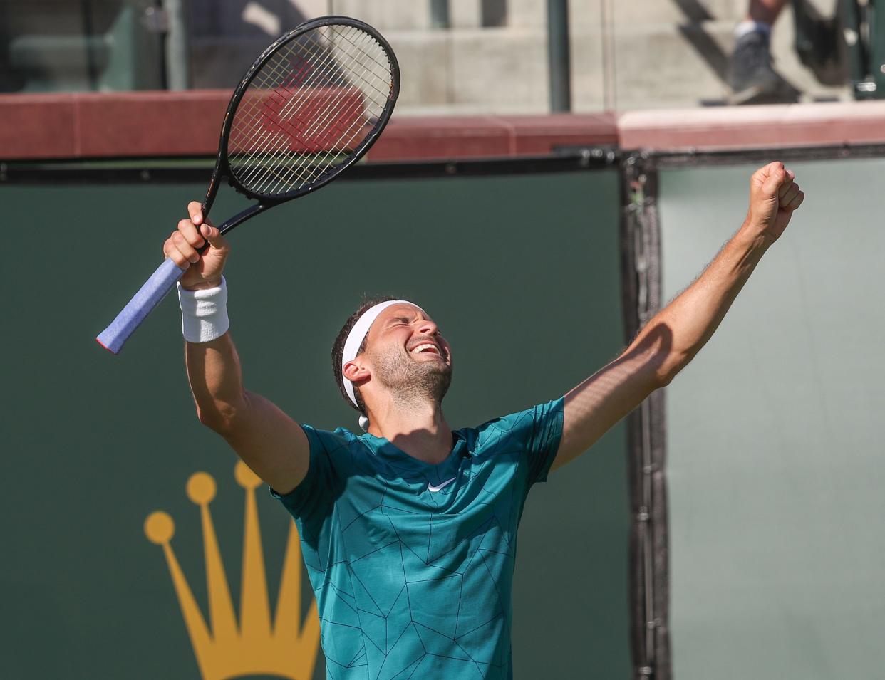 Grigor Dimitrov celebrates his win over John Isner during the BNP Paribas Open in Indian Wells, Calif., March 16, 2022.