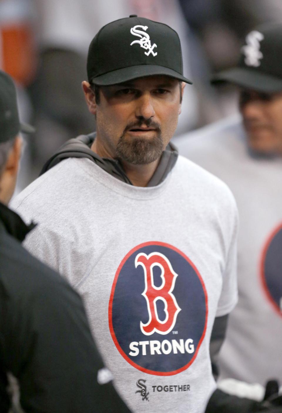 Chicago White Sox's Paul Konerko wears a Boston Strong shirt during ceremonies before the White Sox's baseball game against the Boston Red Sox in Chicago on Tuesday, April 15, 2014, one year after the Boston Marathon bombings. (AP Photo/Charles Rex Arbogast)