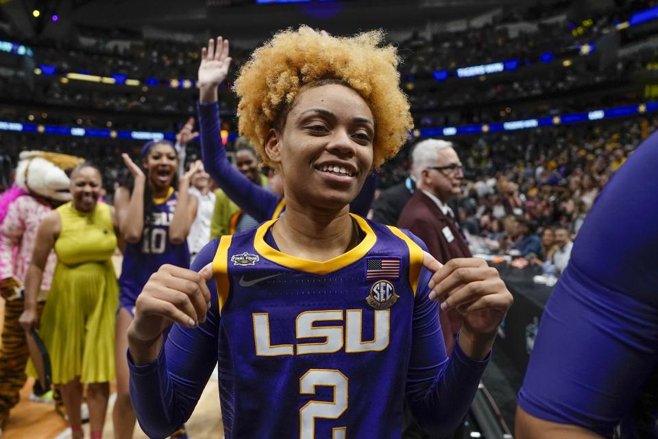 LSU's Jasmine Carson celebrates in the crowd after an NCAA Women's Final Four semifinals basketball game against Virginia Tech Friday, March 31, 2023, in Dallas. LSU won 79-72 to advance to the championship game on Sunday. (AP Photo/Darron Cummings)