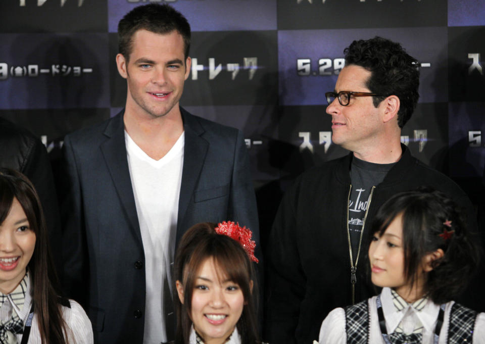 U.S. director J.J. Abrams, right, and actor of his film "Star Trek" Chris Pine pose with Japanese singing group AKB 48 during a news conference at a Tokyo hotel in Japan Wednesday, May 13, 2009. (AP Photo/Itsuo Inouye)