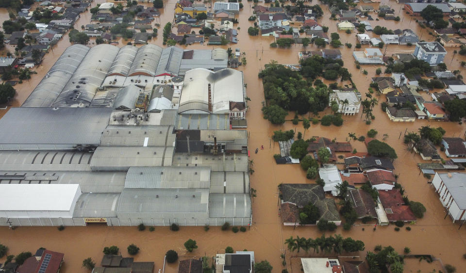 Streets are flooded after heavy rain in Sao Sebastiao do Cai, Rio Grande do Sul state, Brazil, Thursday, May 2, 2024. (AP Photo/Carlos Macedo)