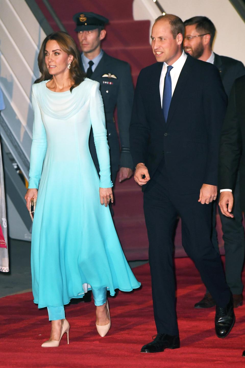 Kate Middleton and Prince William <a href="https://people.com/royals/kate-middleton-and-prince-william-touch-down-in-pakistan-for-the-start-of-their-royal-tour/" rel="nofollow noopener" target="_blank" data-ylk="slk:arrived in Pakistan to kick off their five day royal tour;elm:context_link;itc:0;sec:content-canvas" class="link ">arrived in Pakistan to kick off their five day royal tour</a>. Kate looked elegant in an aqua blue bespoke flowing top and fitted pants by Catherine Walker, which she paired with nude pumps and a matching clutch. <strong>Get the Look!</strong> Ibtom Castle Evening Long Maxi Gradient Ombre Dress, $11.85–$30.25; <a href="https://www.amazon.com/Infinity-Gradient-Convertible-Multi-Way-Elasticity/dp/B07L4459WV/ref=as_li_ss_tl?dchild=1&keywords=blue+ombre+maxi+dress+women&qid=1571080059&sr=8-2&linkCode=ll1&tag=poamzfkatemiddletonfallstylekphillips1019-20&linkId=63dc0eb66f96f91ea52fecd706919908&language=en_US" rel="nofollow noopener" target="_blank" data-ylk="slk:amazon.com;elm:context_link;itc:0;sec:content-canvas" class="link ">amazon.com</a> Alice + Olivia Joleen Pleated Midi Dress, $485; <a href="https://click.linksynergy.com/deeplink?id=93xLBvPhAeE&mid=13867&murl=https%3A%2F%2Fwww.bloomingdales.com%2Fshop%2Fproduct%2Falice-olivia-joleen-pleated-midi-dress%3FID%3D3434139&u1=PEO%2CShopping%3AEverythingYouNeedtoCopyKateMiddleton%E2%80%99sChicWinterStyle%2Ckamiphillips2%2CUnc%2CGal%2C7360903%2C202002%2CI" rel="nofollow noopener" target="_blank" data-ylk="slk:bloomingdales.com;elm:context_link;itc:0;sec:content-canvas" class="link ">bloomingdales.com</a> Porridge Marcienne Maxi Dress, $180; <a href="https://click.linksynergy.com/deeplink?id=93xLBvPhAeE&mid=39789&murl=https%3A%2F%2Fwww.anthropologie.com%2Fshop%2Fmarcienne-maxi-dress&u1=PEO%2CShopping%3AEverythingYouNeedtoCopyKateMiddleton%E2%80%99sChicWinterStyle%2Ckamiphillips2%2CUnc%2CGal%2C7360903%2C202002%2CI" rel="nofollow noopener" target="_blank" data-ylk="slk:anthropologie.com;elm:context_link;itc:0;sec:content-canvas" class="link ">anthropologie.com</a> Rachel Parcell Tiered Long Sleeve Maxi Dress, $83.40 (orig. $139); <a href="https://click.linksynergy.com/deeplink?id=93xLBvPhAeE&mid=1237&murl=https%3A%2F%2Fshop.nordstrom.com%2Fs%2Frachel-parcell-tiered-long-sleeve-maxi-dress-nordstrom-exclusive%2F5227519&u1=PEO%2CShopping%3AEverythingYouNeedtoCopyKateMiddleton%E2%80%99sChicWinterStyle%2Ckamiphillips2%2CUnc%2CGal%2C7360903%2C202002%2CI" rel="nofollow noopener" target="_blank" data-ylk="slk:nordstrom.com;elm:context_link;itc:0;sec:content-canvas" class="link ">nordstrom.com</a>