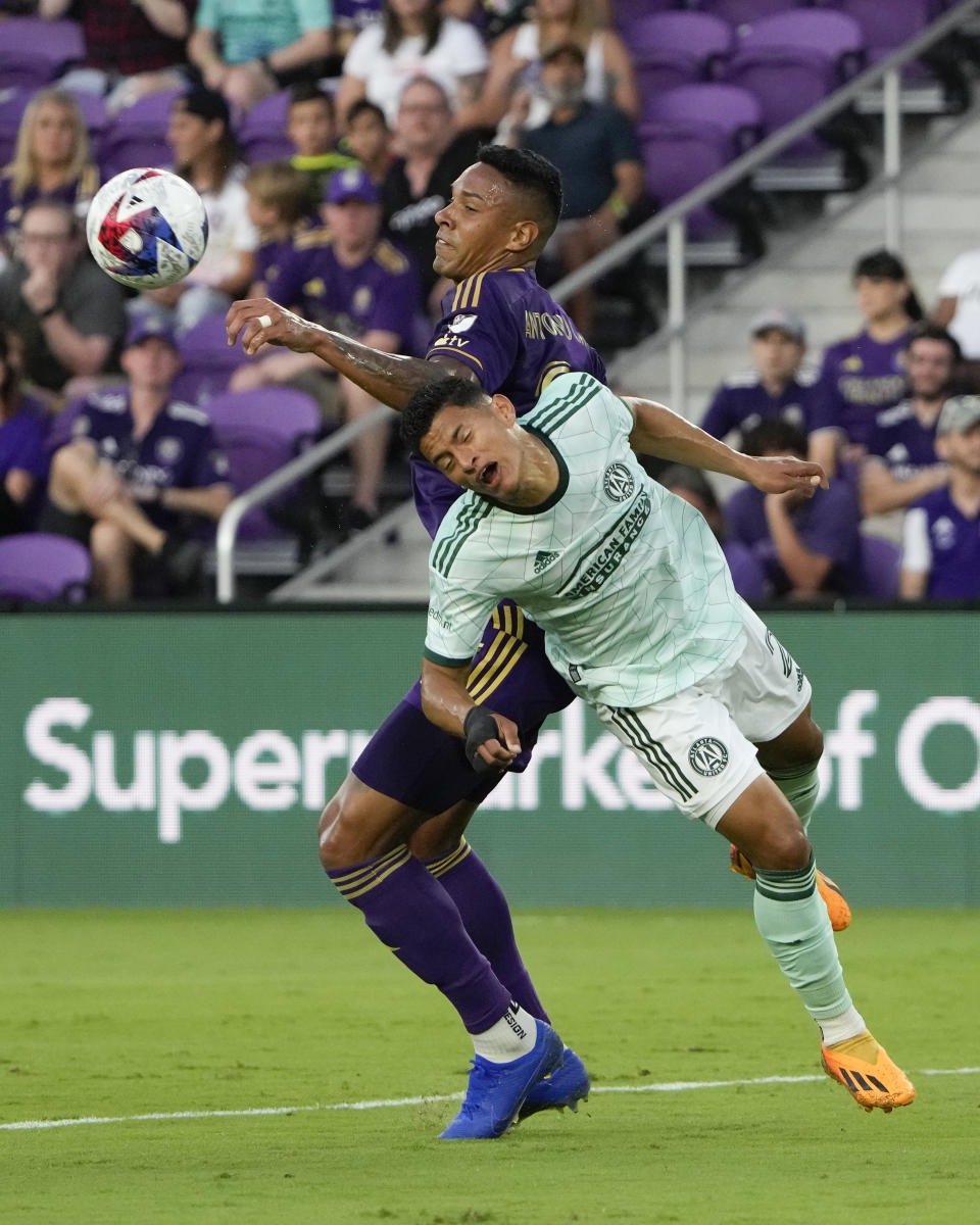 Orlando City defender Antonio Carlos, top, controls the ball in front of Atlanta United defender Ronald Hernandez (2) during the first half of an MLS soccer match, Saturday, May 27, 2023, in Orlando, Fla. (AP Photo/John Raoux)