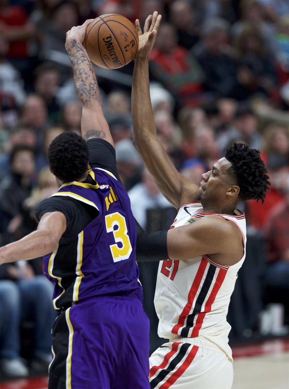 Portland Trail Blazers center Hassan Whiteside, right, has a shot blocked by Los Angeles Lakers forward Anthony Davis during the second half of an NBA basketball game in Portland, Ore., Friday, Dec. 6, 2019. (AP Photo/Craig Mitchelldyer)