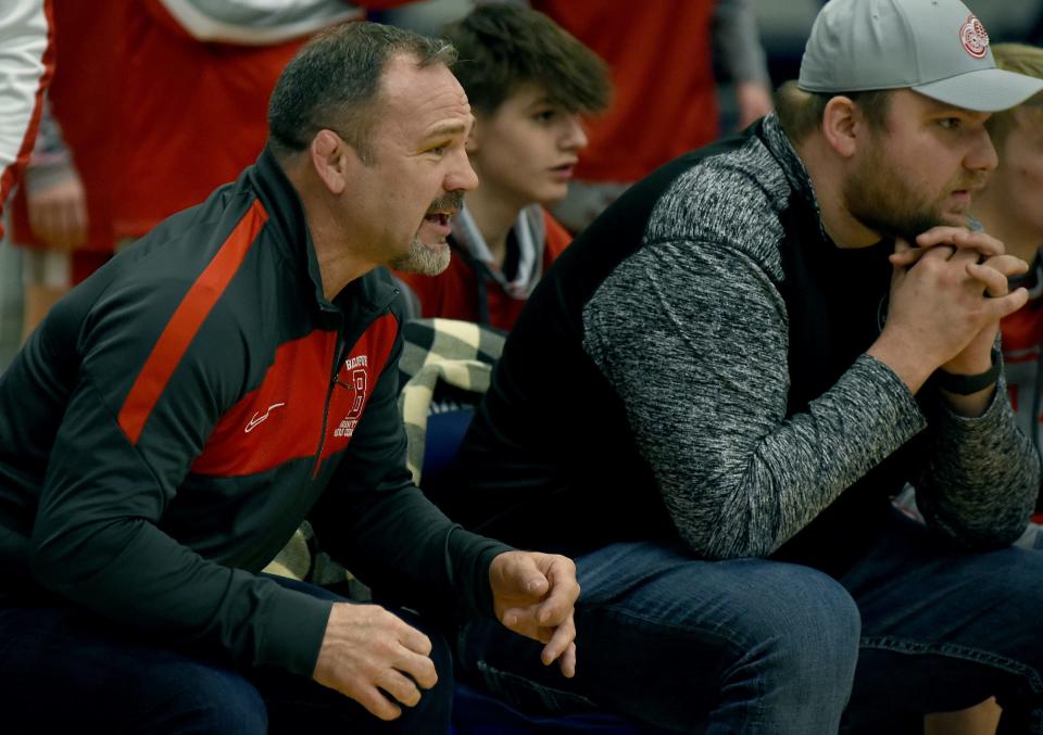 Bedford wrestling coach Kevin Vogel watches intently with assistant coach Logan Rimmer encourage their wrestlers during the Division 1 Team Regionals at Gibraltar Carlson High School on Feb. 14, 2024 against Westland John Glenn.