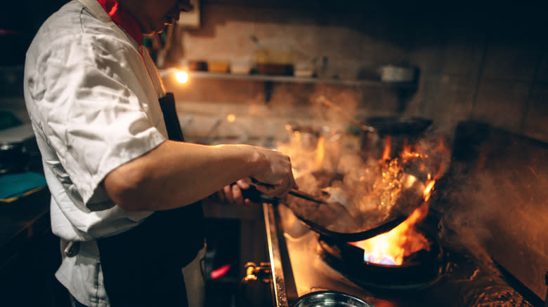 Wok being used by chef