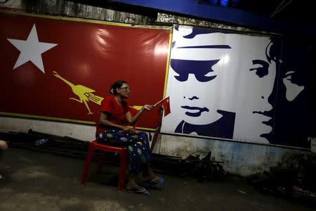 A supporter of Myanmar's pro-democracy figurehead Aung San Suu Kyi sits inside National League for Democracy headquarters (NLD) in Yangon, Myanmar, November 9, 2015. REUTERS/Jorge Silva