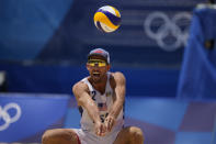 Nicholas Lucena, of the United States, competes during a men's beach volleyball match against Argentina at the 2020 Summer Olympics, Thursday, July 29, 2021, in Tokyo, Japan. (AP Photo/Petros Giannakouris)