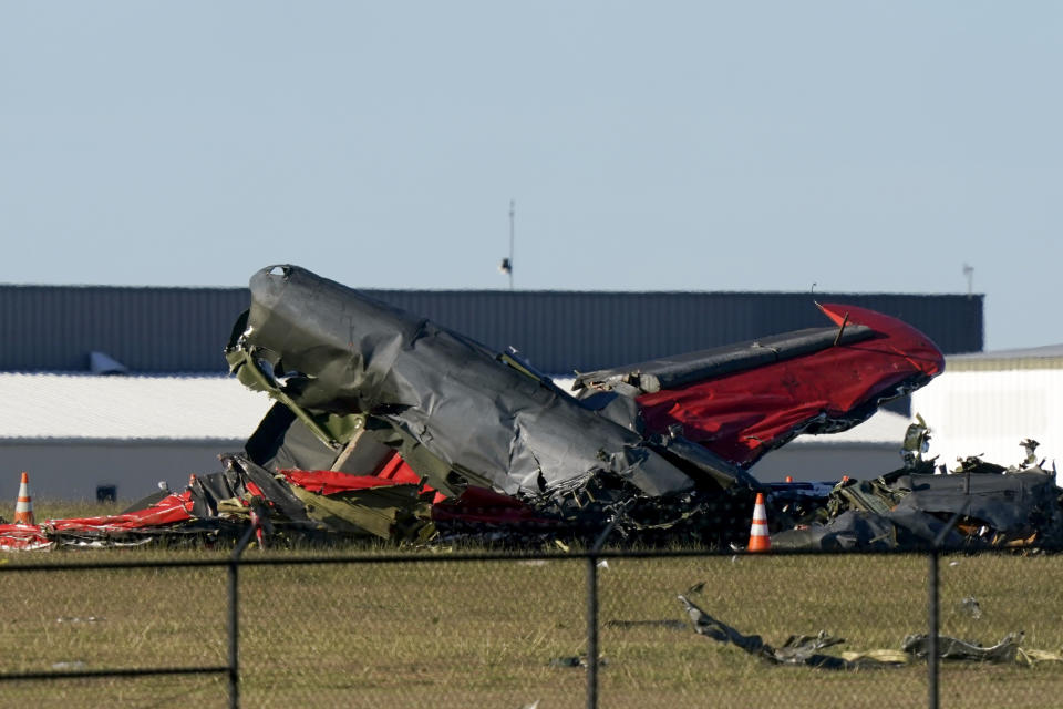 Debris from two planes that crashed during an airshow at Dallas Executive Airport are shown in Dallas. Source: AP