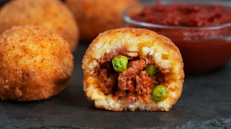 Bisected arancini with meat filling