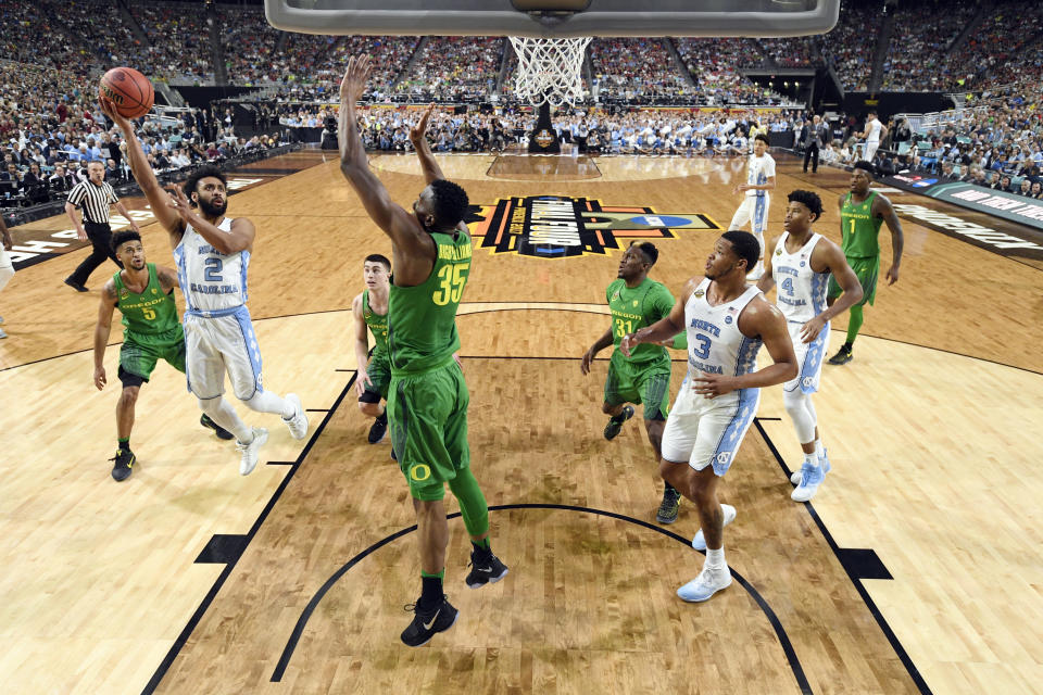 North Carolina's Joel Berry II (2) takes a shot against Oregon's Kavell Bigby-Williams (35) during the second half in the semifinals of the Final Four NCAA college basketball tournament, Saturday, April 1, 2017, in Glendale, Ariz. (AP Photo/Chris Steppig, Pool)