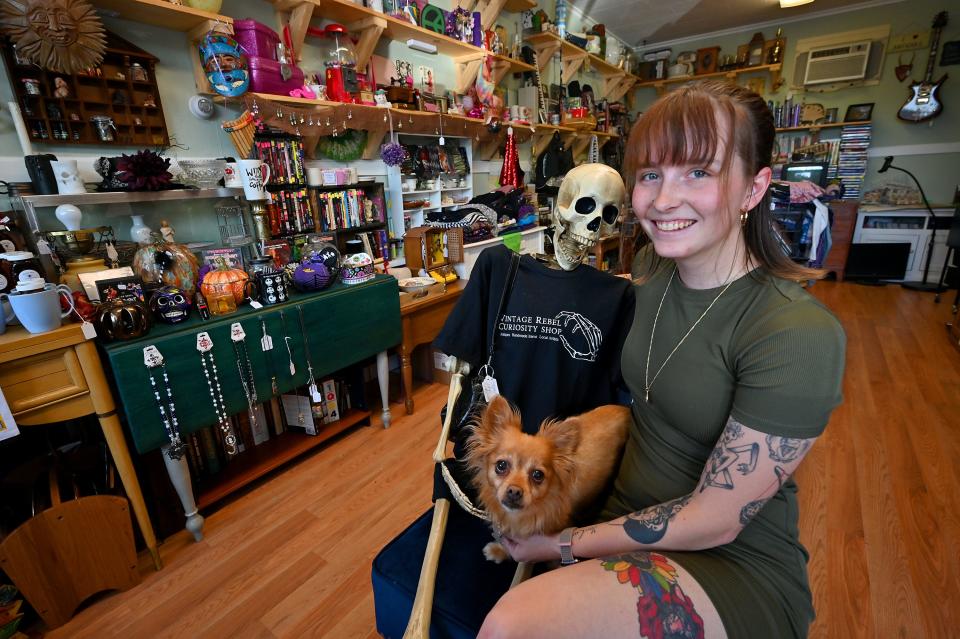 Vintage Rebel Curiosity Shop owner Hayley Worthington with her chiweenie, Kiwi, and a friend.