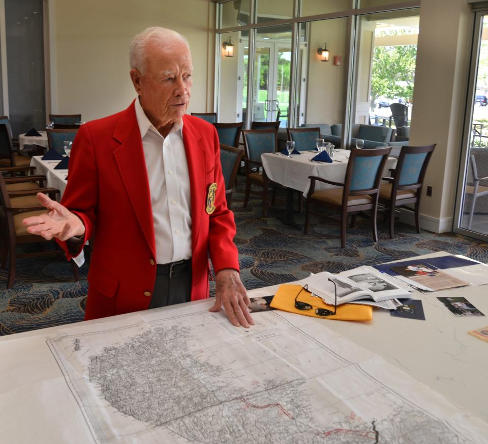Suntree resident Don Mathews, a retired U.S. Air Force colonel, uses a map of the Korean Peninsula to describe his B-26 Invader combat missions during a conversation at the Suntree Country Club.