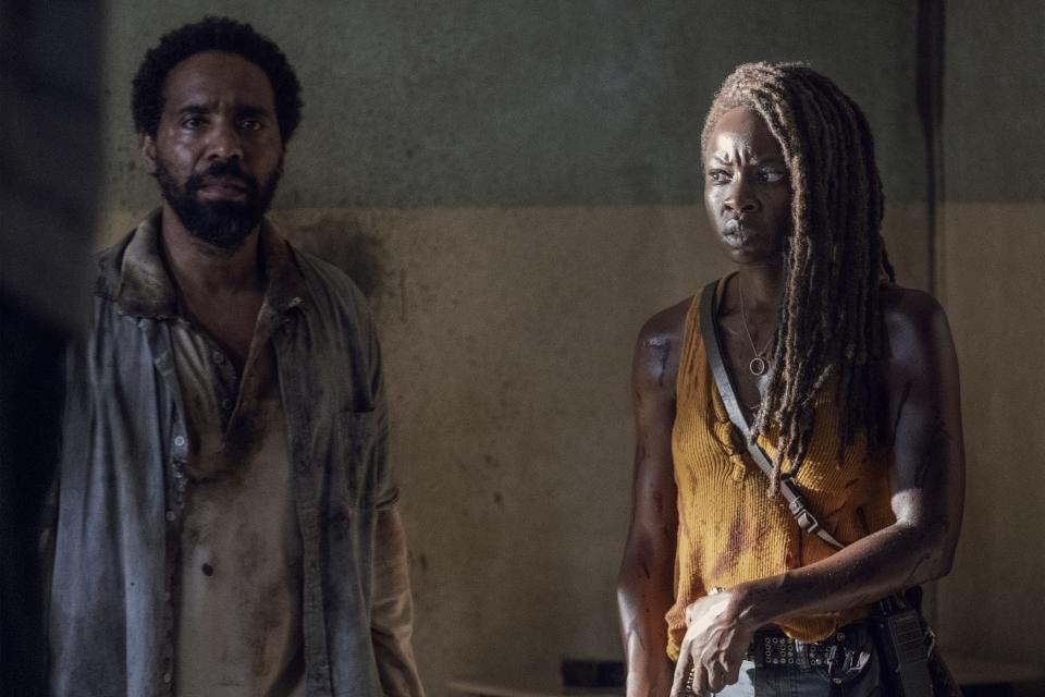 Michonne and Virgil stand in room