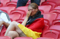 <p>Germany fans look dejected after the match as they go out of the World Cup. REUTERS/Pilar Olivares </p>