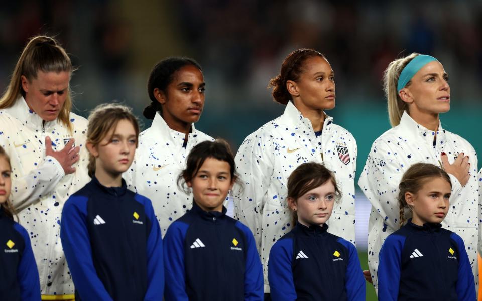 The sound of silence went head-to-head with the Star-Spangled Banner at Eden Park ahead of the Portugal-US match - US women's team refuses to sing the national anthem as eight players remain silent ahead of Portugal game